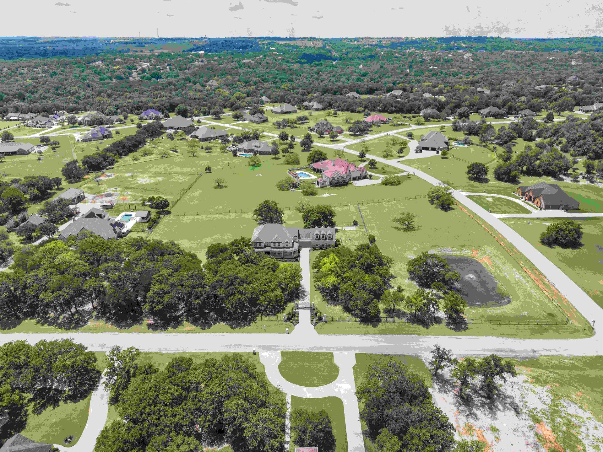 Aerial of the gated driveway and corner lot